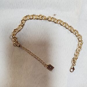 Gold tone chain bracelet.